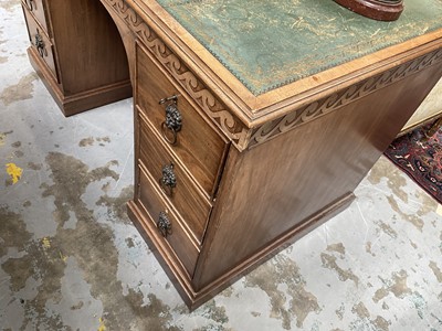 Lot 1259 - Late 19th century mahogany twin pedestal desk, the green leather lined top above an arrangement of six drawers with brass lion mask ring handles