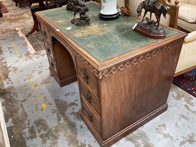 Lot 1259 - Late 19th century mahogany twin pedestal desk, the green leather lined top above an arrangement of six drawers with brass lion mask ring handles