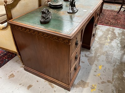 Lot 1259 - Late 19th century mahogany twin pedestal desk, the green leather lined top above an arrangement of six drawers with brass lion mask ring handles