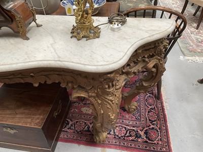 Lot 1260 - 19th century gilt painted and carved console table on four scroll cabriole legs with floral crestings and a serpentine marble top