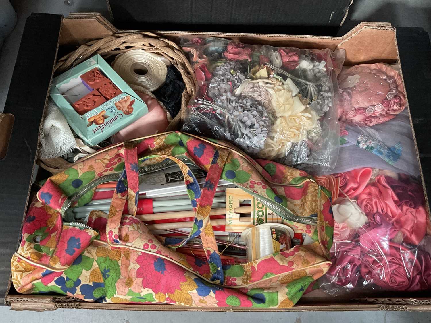 Lot 48 - Two boxes of mixed linen and lace, two boxes of material, two boxes of vintage sewing items, and one box of vintage baby clothes (7 boxes)