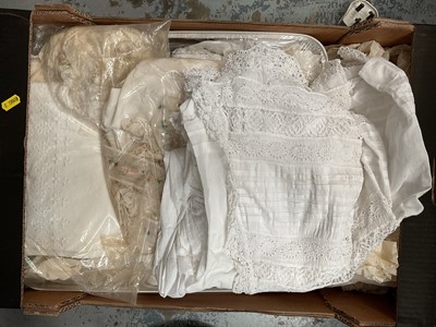 Lot 48 - Two boxes of mixed linen and lace, two boxes of material, two boxes of vintage sewing items, and one box of vintage baby clothes (7 boxes)