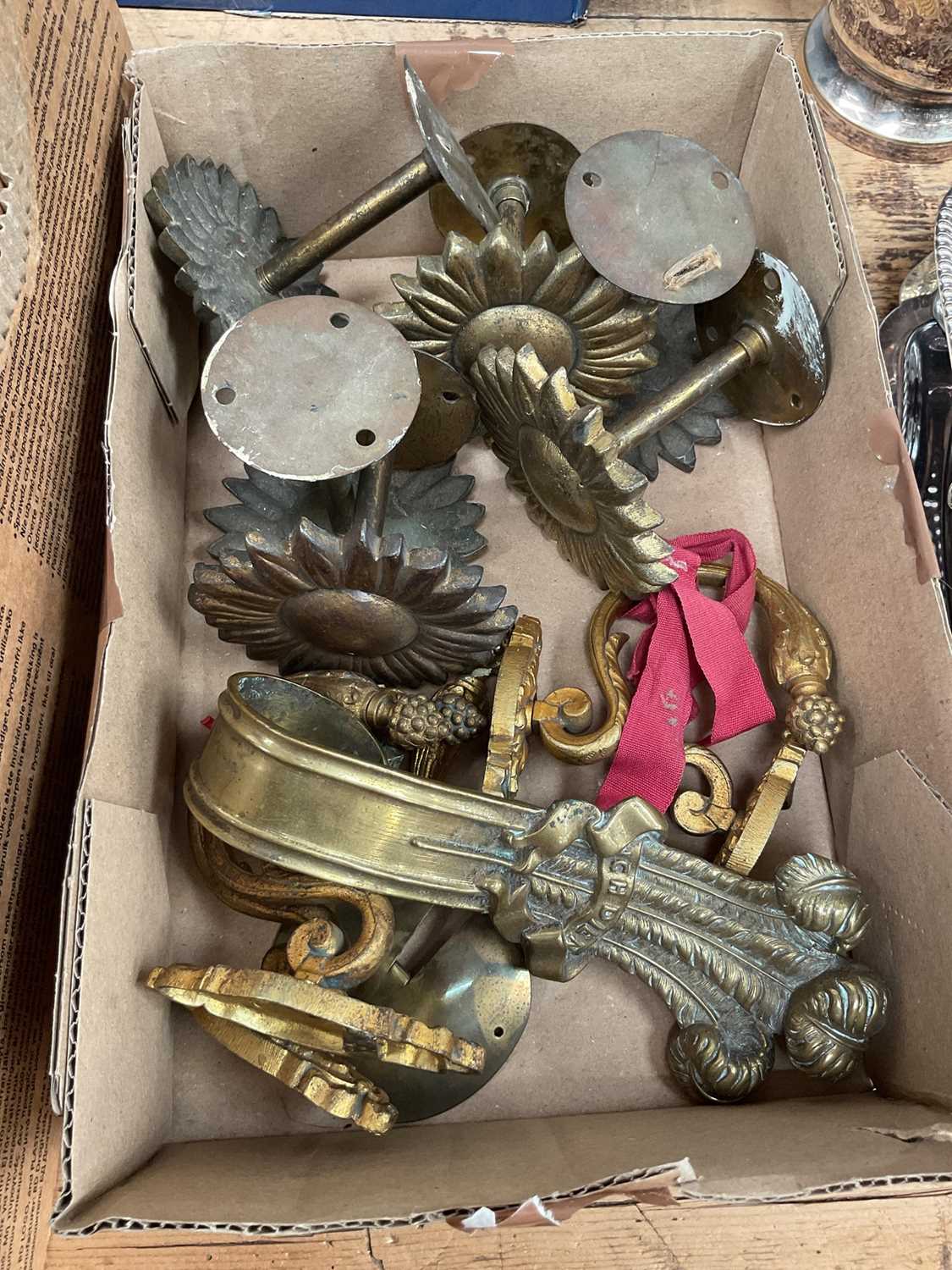 Lot 28 - Good set of six antique brass curtain ties together with one tie in the shape of Prince of Wales Feathers