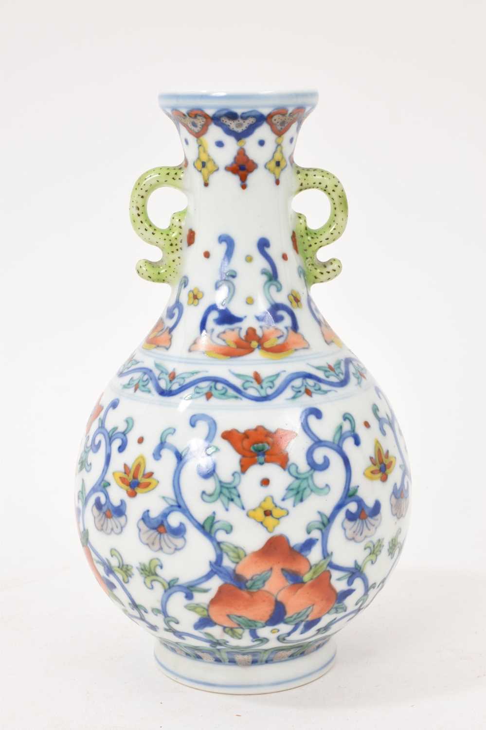 Lot 41 - Chinese porcelain twin-handled vase, 20th century decorated in the Doucai style, Qianlong seal mark to base