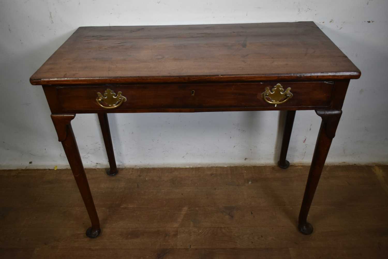 Lot 1280 - George II walnut single drawer side table