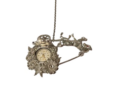 Lot 70 - 1950s silver and marcasite novelty brooch in the form of a horse pulling a floral carriage with a concealed Bimesa watch, 50mm