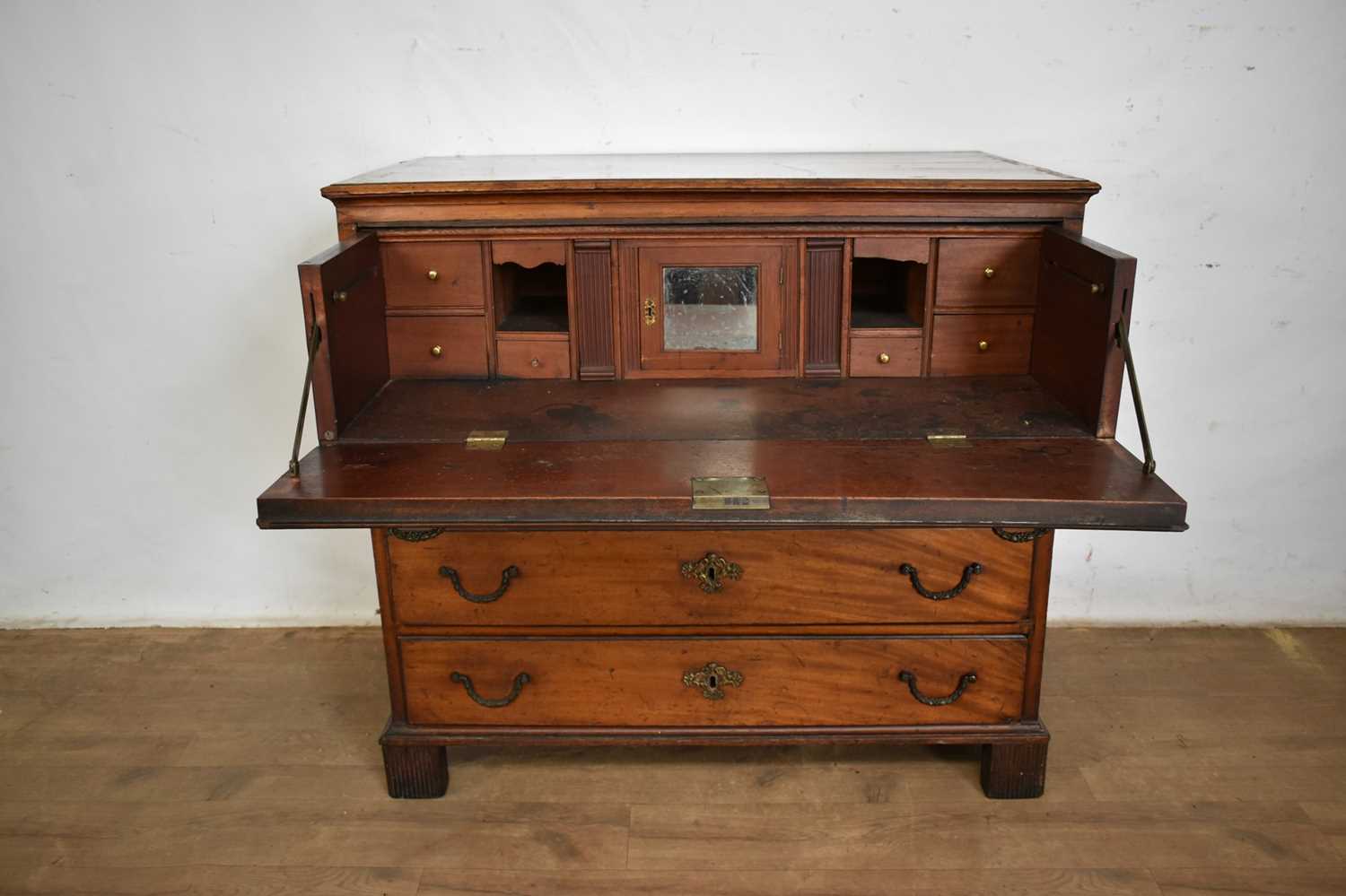 Lot 1298 - George III mahogany secretaire chest