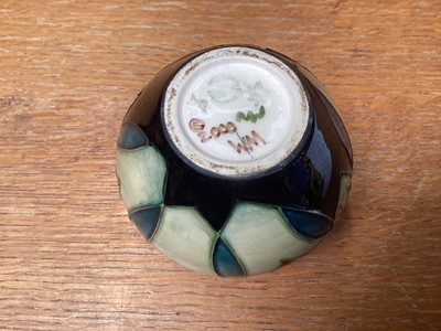 Lot 1110 - Moorcroft pottery vase decorated in the Trillium pattern, dated 2000, 8.5cm high