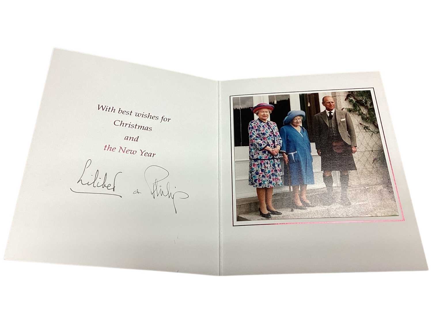 Lot 6 - H.M. Queen Elizabeth II and H.R.H. The Duke of Edinburgh, scarce hand signed 1999 Christmas card with twin gilt embossed Royal cyphers to cover, colour photograph of the Royal couple with The Quee...
