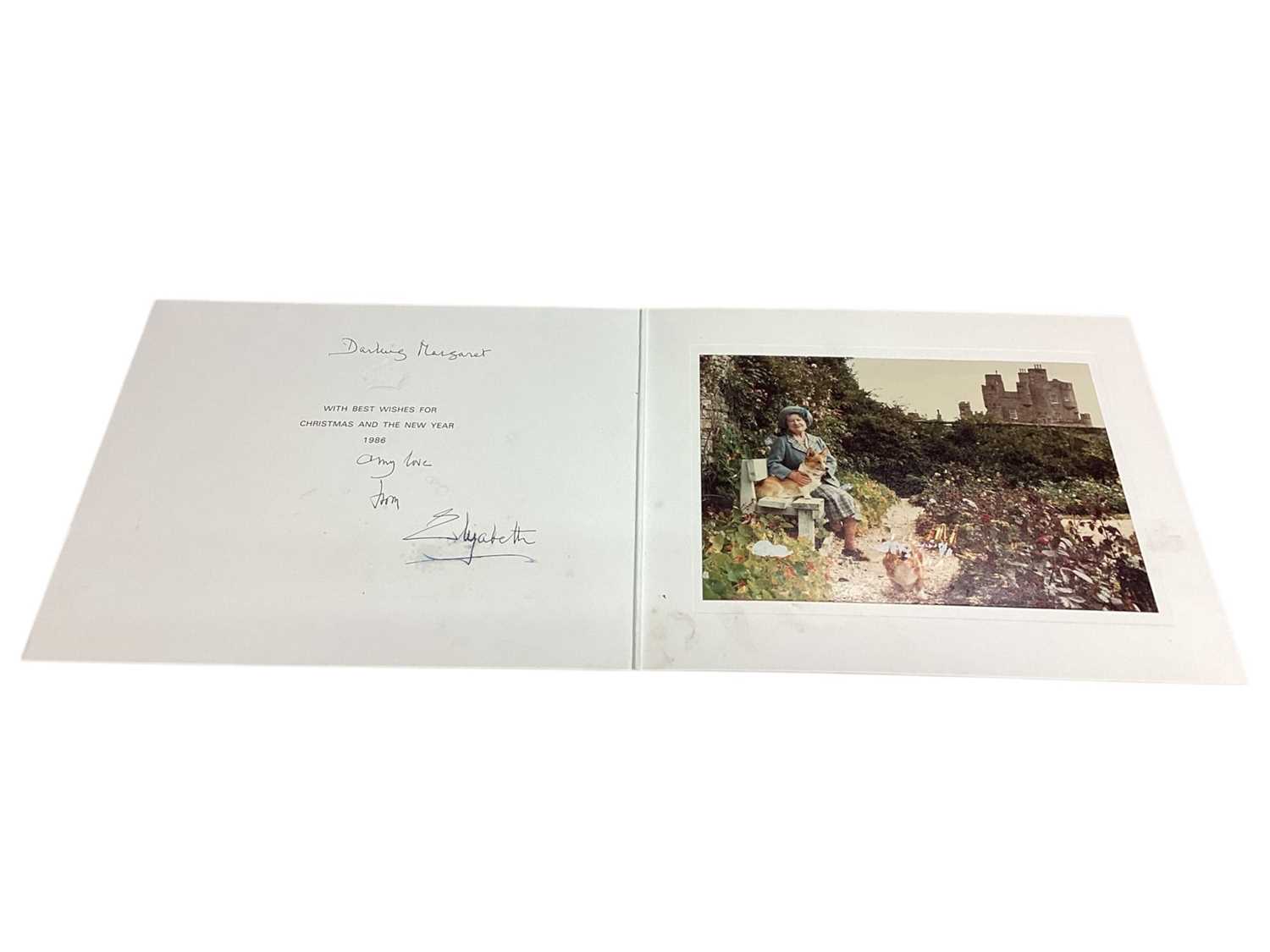 Lot 10 - H.M. Queen Elizabeth The Queen Mother, scarce signed 1986 family Christmas card with gilt embossed crown to cover, colour photograph of Her Majesty with corgis at Birkhall to the interior, signe...