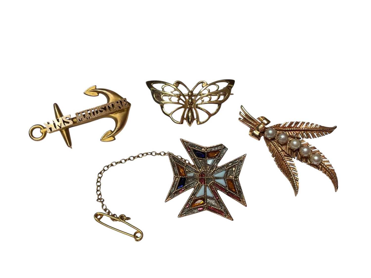 Lot 27 - Four gold brooches to include 9ct gold HMS Maidstone anchor, 9ct gold butterfly, 9ct gold and cultured pearls fern leaf spray and a yellow metal gem set Maltese cross brooch