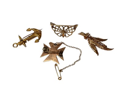 Lot 27 - Four gold brooches to include 9ct gold HMS Maidstone anchor, 9ct gold butterfly, 9ct gold and cultured pearls fern leaf spray and a yellow metal gem set Maltese cross brooch