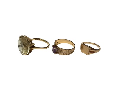Lot 29 - 9ct gold large citrine single stone cocktail ring, 9ct gold amethyst ring in four claw setting on bark effect shank and 9ct gold signet ring (3)