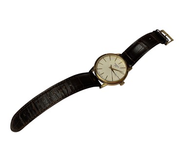 Lot 40 - Tissot 'Classic Dream' gold plated stainless steel quartz wristwatch, 42mm diameter, on Tissot brown leather strap, boxed with original reciept