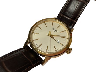 Lot 40 - Tissot 'Classic Dream' gold plated stainless steel quartz wristwatch, 42mm diameter, on Tissot brown leather strap, boxed with original reciept