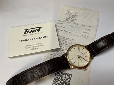 Lot 40 - Tissot 'Classic Dream' gold plated stainless steel quartz wristwatch, 42mm diameter, on Tissot brown leather strap, boxed with original reciept
