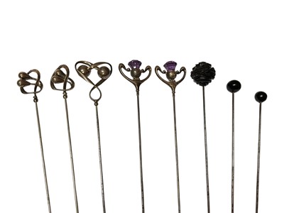 Lot 36 - Three Charles Horner silver topped hat pins, pair of silver and amethyst thistle hat pins and three others (8)