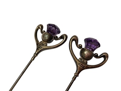 Lot 36 - Three Charles Horner silver topped hat pins, pair of silver and amethyst thistle hat pins and three others (8)
