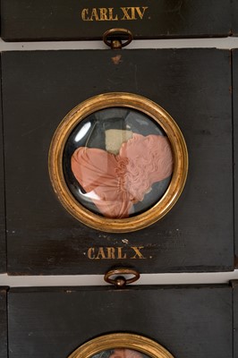Lot 739 - Set of sixteen 19th century wax profile portraits of European royals