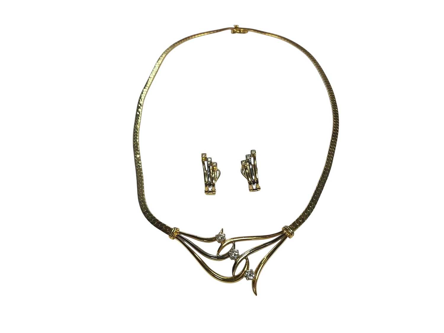 Lot 65 - Gold and diamond three stone necklace, together with a pair of similar style earrings