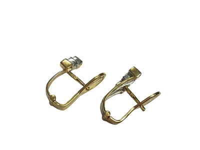 Lot 65 - Gold and diamond three stone necklace, together with a pair of similar style earrings