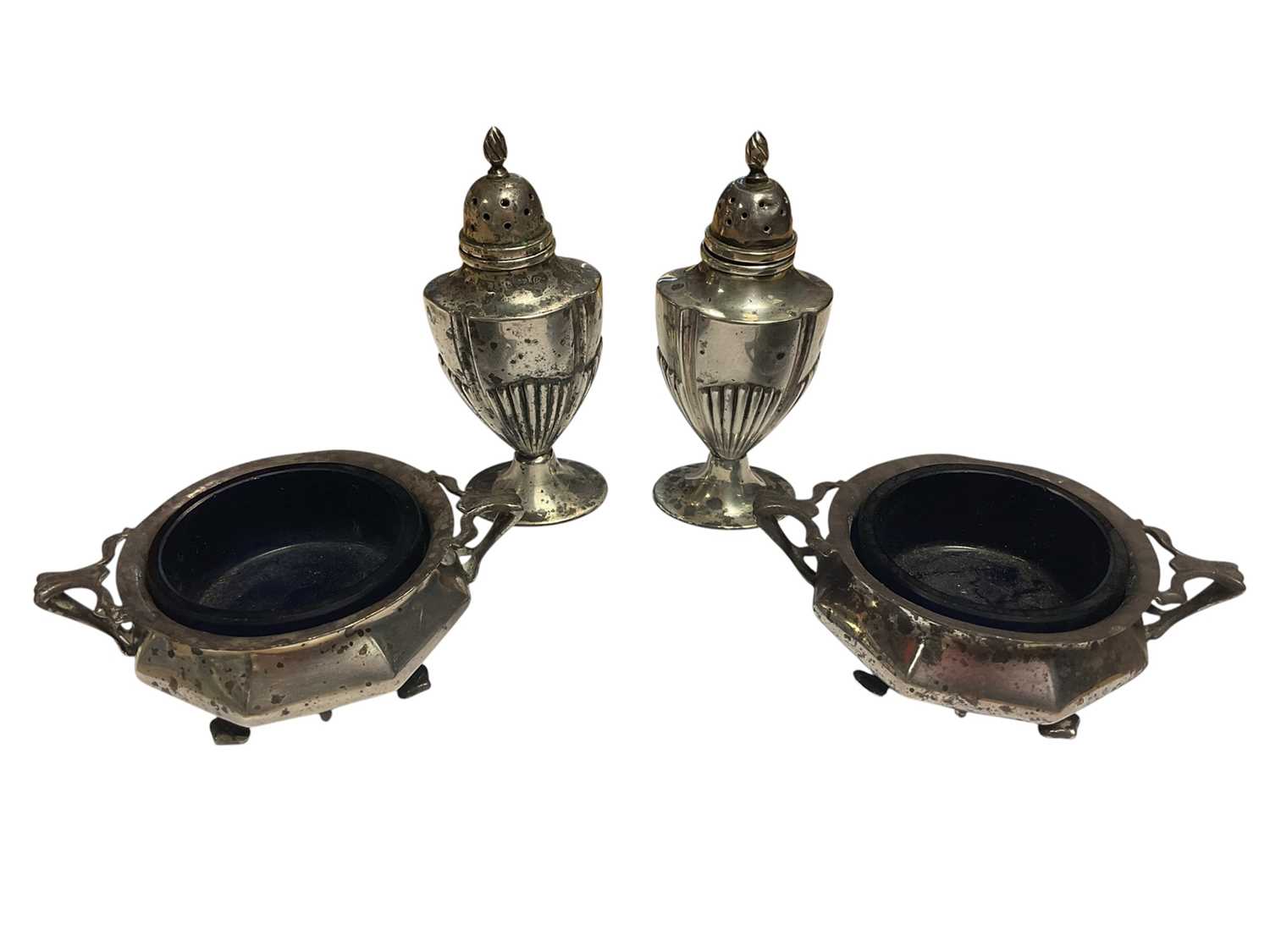Lot 81 - Pair of Edwardian silver condiments with blue glass liners and pair of silver pepperettes