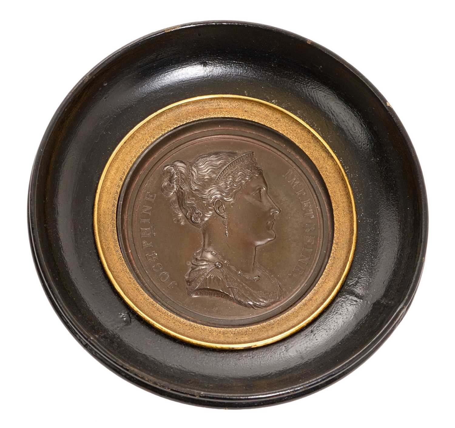 Lot 13 - Josephine de Beauharnais (1763-1814), Consort of Napoleon Bonaparte and Empress of France, bronze medal by Andrieu Bertrand, approximately 6.5cm in diameter, in a ebonised wood frame, the fram...