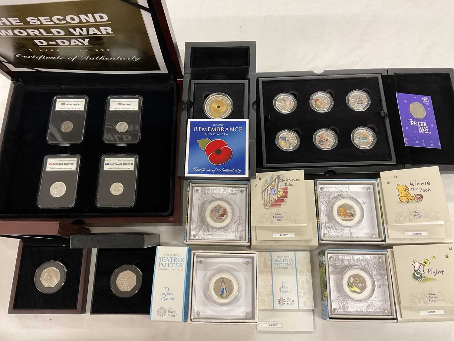 Lot 566 - World - Mixed coinage to include Royal Mint silver coloured proof 50p's, 2020 Winnie The Pooh. Christopher Robin & Piglet (N.B. All cased with Certificates of Authenticity), Jersey silver pr...