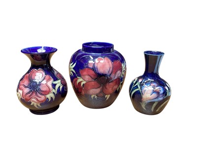 Lot 2202 - Three Moorcroft anemone pattern vases