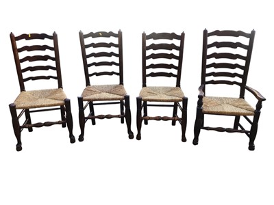 Lot 5373 - Seven antique ladder back chairs with rush seats and an Art deco shell chair with pink upholstery, 68cm tall x 64cm wide