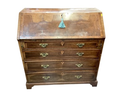 Lot 1308 - George II walnut bureau, the fall front encoding a fitted interior, above four long graduated drawers, on bracket feet