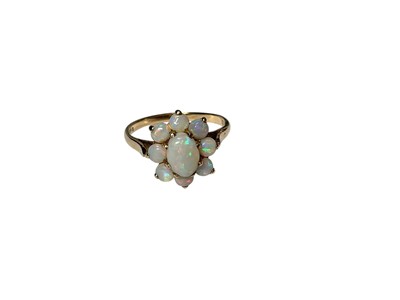 Lot 82 - Opal flower head cluster ring in 9ct gold setting, size M½, in a Victorian heart shaped ring box