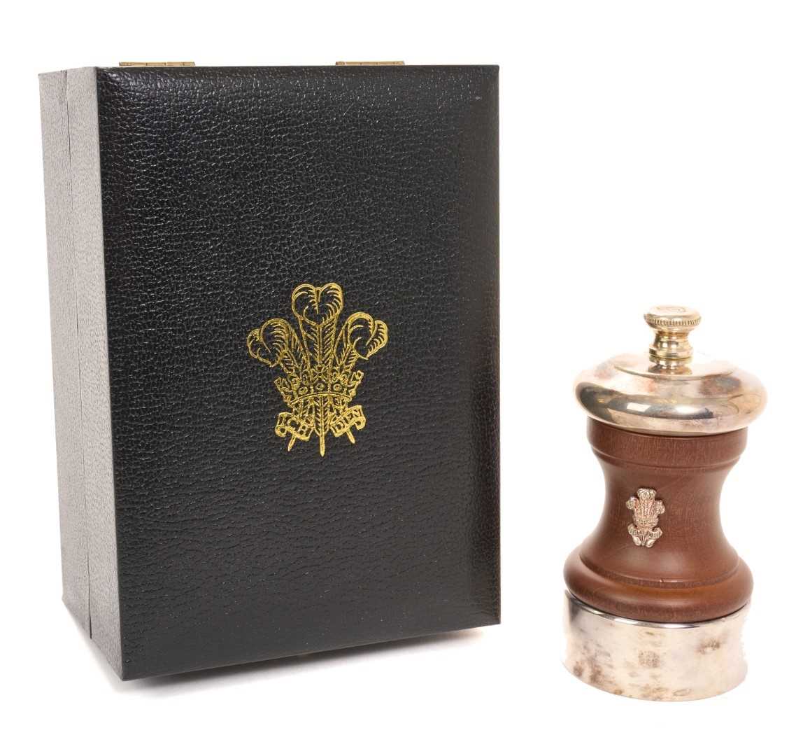 Lot 62 - H.R.H. Prince Charles Prince of Wales, Royal Christmas gift pepper grinder with silver plated mounts, turned wood body with silver Prince of Wales feather crest in original fitted box with gilt e...