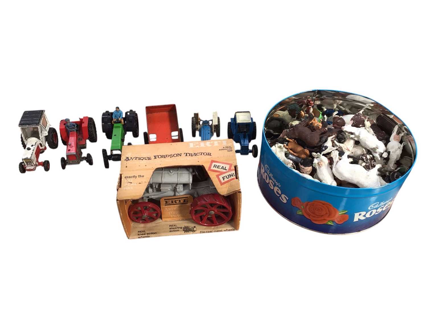 Lot 5009 - American Ertl model of an antique Fordson tractor, boxed, with other tractors and a selection of Britains and other plastic farm figures