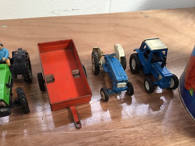 Lot 5009 - American Ertl model of an antique Fordson tractor, boxed, with other tractors and a selection of Britains and other plastic farm figures