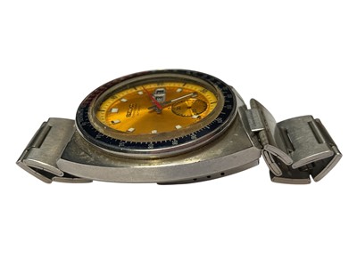 Lot 64 - 1970s Seiko Chronograph Automatic wristwatch, with circular yellow dial, day and date aperture, subsidiary seconds, red and blue 'Pepsi' bezel measuring 38mm diameter, in a stainless steel case...
