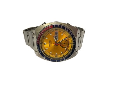 Lot 64 - 1970s Seiko Chronograph Automatic wristwatch, with circular yellow dial, day and date aperture, subsidiary seconds, red and blue 'Pepsi' bezel measuring 38mm diameter, in a stainless steel case...