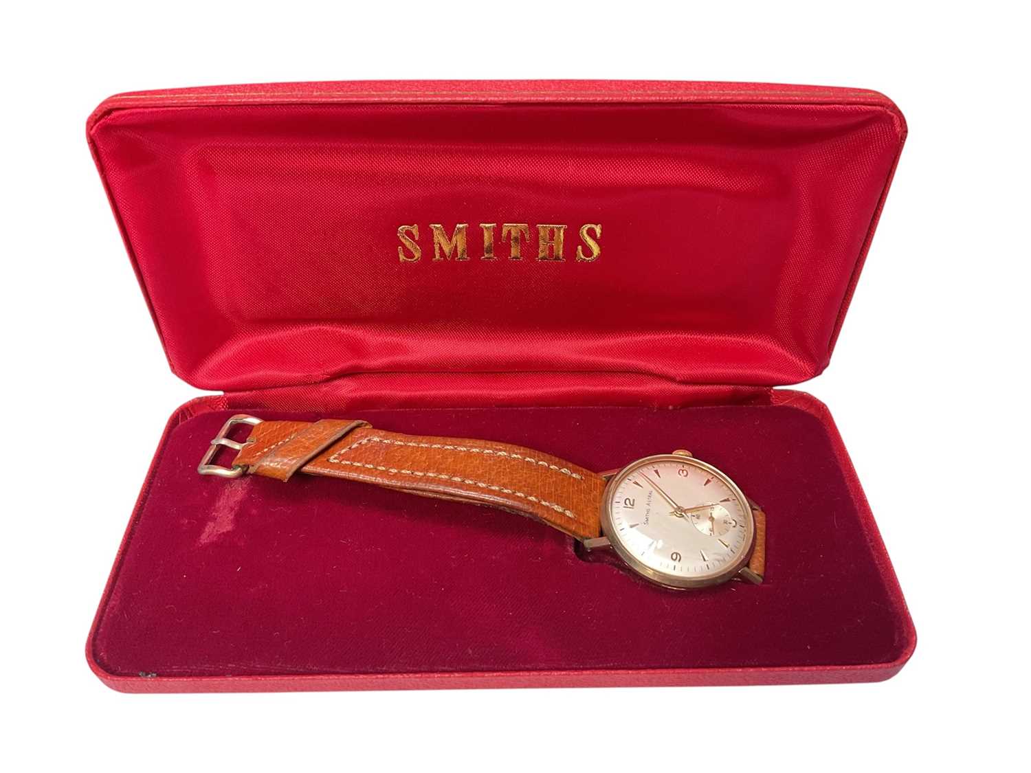 Lot 65 - 1960s 9ct gold cased Smiths Astral wristwatch (Edinburgh 1965) with engraved presentation inscription to reverse, 32mm diameter, on brown leather strap, in Smiths red case
