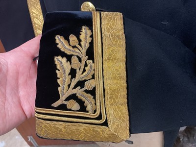Lot 5 - H.M. Queen Elizabeth II British Diplomats' court uniform comprising tailcoat with gold bullion work decoration and gilt brass Royal Coat of Arms buttons, trousers with broad gold bullion strip,...