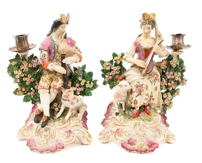 Lot Pair of 18th century Derby porcelain figural candlesticks