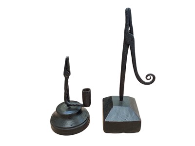 Lot 5037 - Two antique wrought iron rush light holders on wooden bases