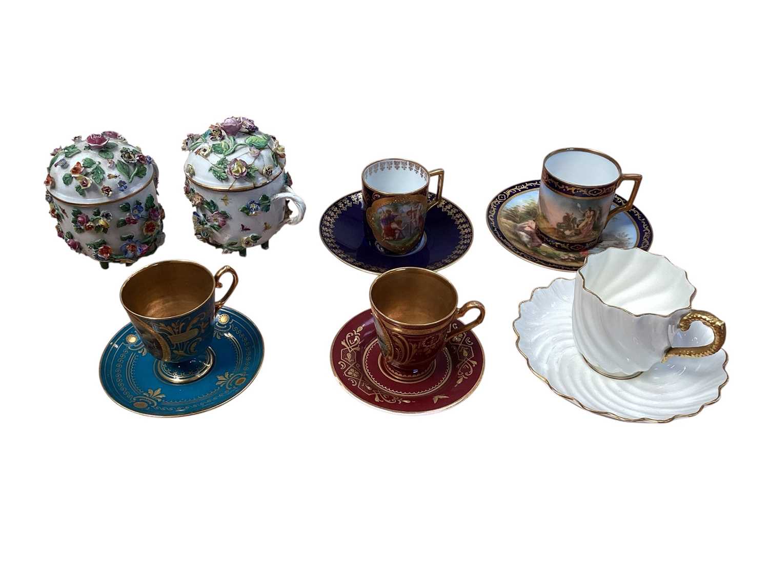Lot 5047 - Group of four Vienna porcelain cups and saucers, together with two Dresden floral encrusted chocolate cups and covers, and a Coalport fluted cup and saucer