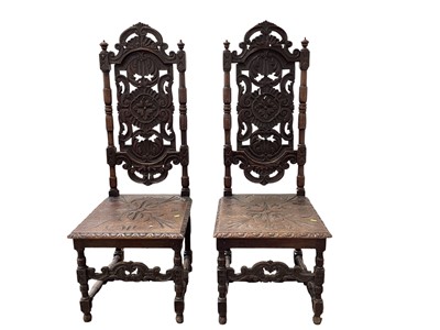 Lot 5384 - Pair of 18th century style carved oak hall chairs measuring 129cm tall