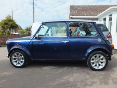 Lot 2000 Rover Mini Cooper Sport 1275cc, reg. no. X497 VRL, chassis no. XNPAZEYD186590, finished in Tahiti blue with silver roof and bonnet stripes. 22,460 miles, two previous owners, the current ow...