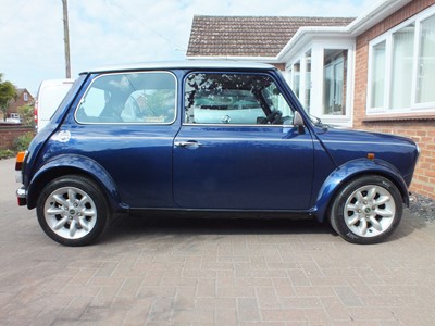 Lot 2000 Rover Mini Cooper Sport 1275cc, reg. no. X497 VRL, chassis no. XNPAZEYD186590, finished in Tahiti blue with silver roof and bonnet stripes. 22,460 miles, two previous owners, the current ow...