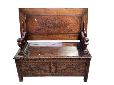 Lot 5379 - Carved oak Monks bench with carved lions, 106cm wide