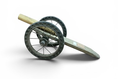 Lot 836 - Second World War French Trench Art cannon, constructed from pram wheels and a shell case, with applied plaque "Canon A Poudre 1944 Le Jeune Jean", 60.5cm in length.