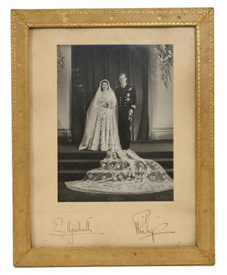 Lot T.R.H. The Princess Elizabeth (later H.M. Queen Elizabeth II) and The Duke of Edinburgh, signed 1947 wedding portrait photograph