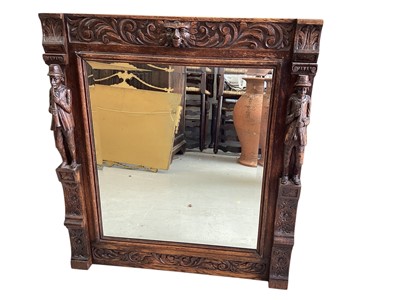 Lot 5336 - Impressive oak mirror, the top with a Green Man and scrolled foliage, the sides with figural pilasters in high relief, with further foliate patterns, 90.5cm x 80cm
