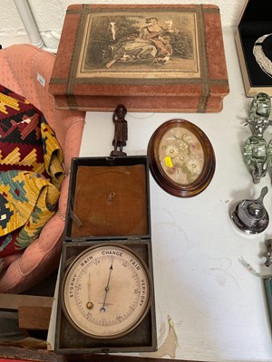 Lot 5101 - Short & Mason aneroid barometers (a/f), a small pure wool embroidery, carved wooden figure, and a fabric covered box with French print to lid (4)